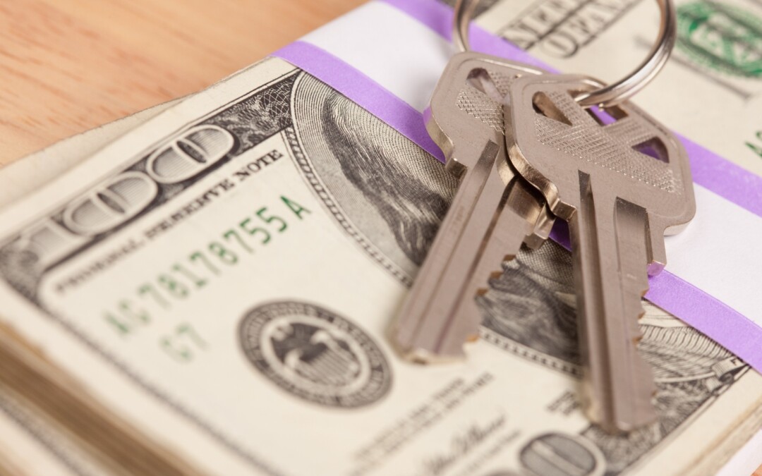 Money with home keys on top