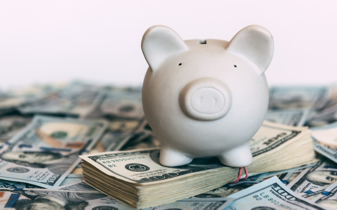 Piggy bank on top of money